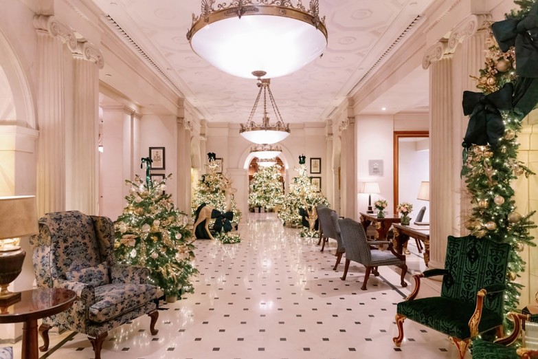 The Lanesborough Hotel - Hall and Entrance with Dazzling White theme, lush greenery, Christmas trees, and dazzling fairy lights