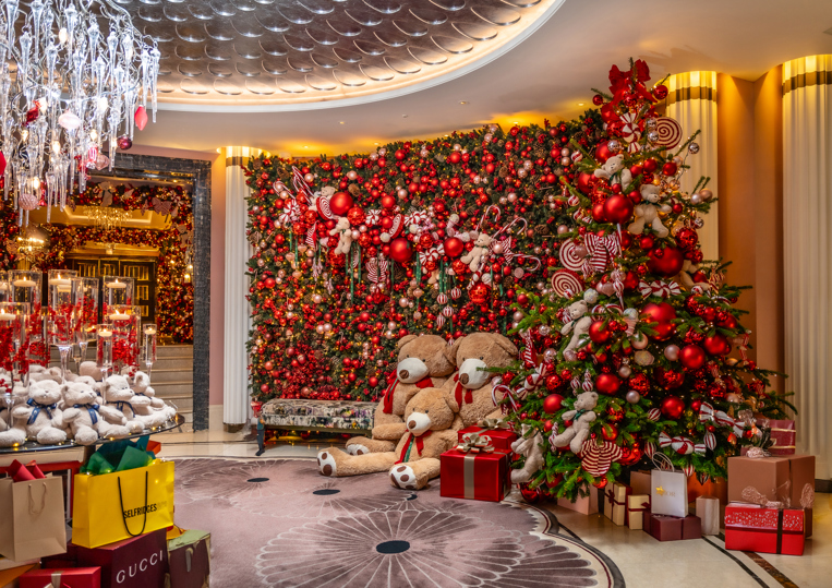 The Biltmore Mayfair Lobby - Extravagant Christmas Decorations With Candy Cane's, Red Baubles, Huge Stufed Animals, and Shopping Bags