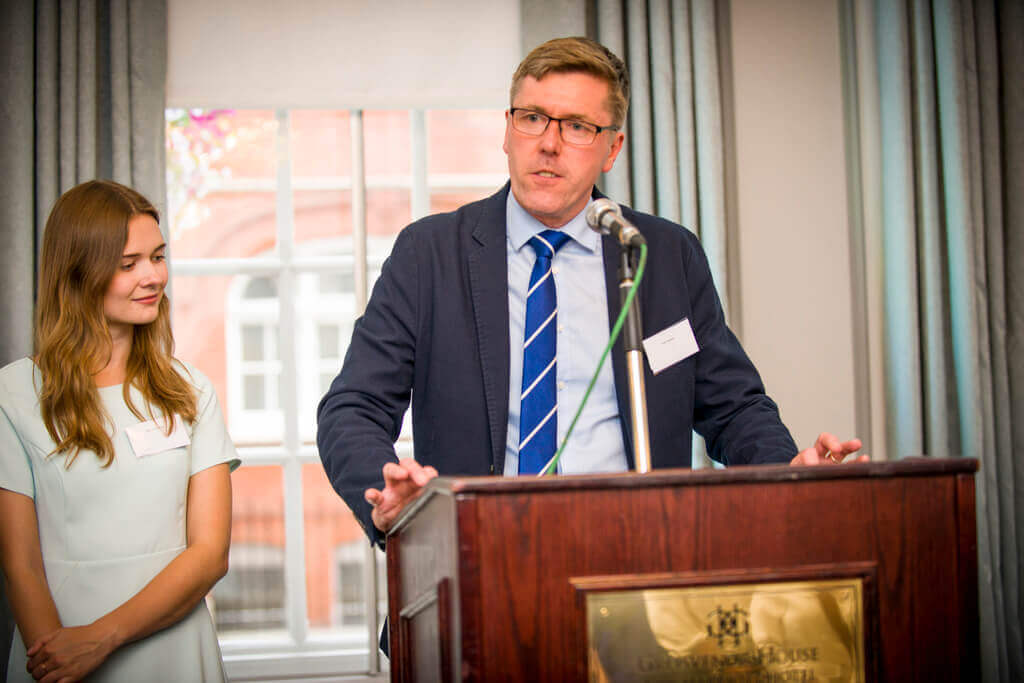 AfternoonTea.co.uk Managing Director, Keith Newton, presents an award alongside Martha Collison